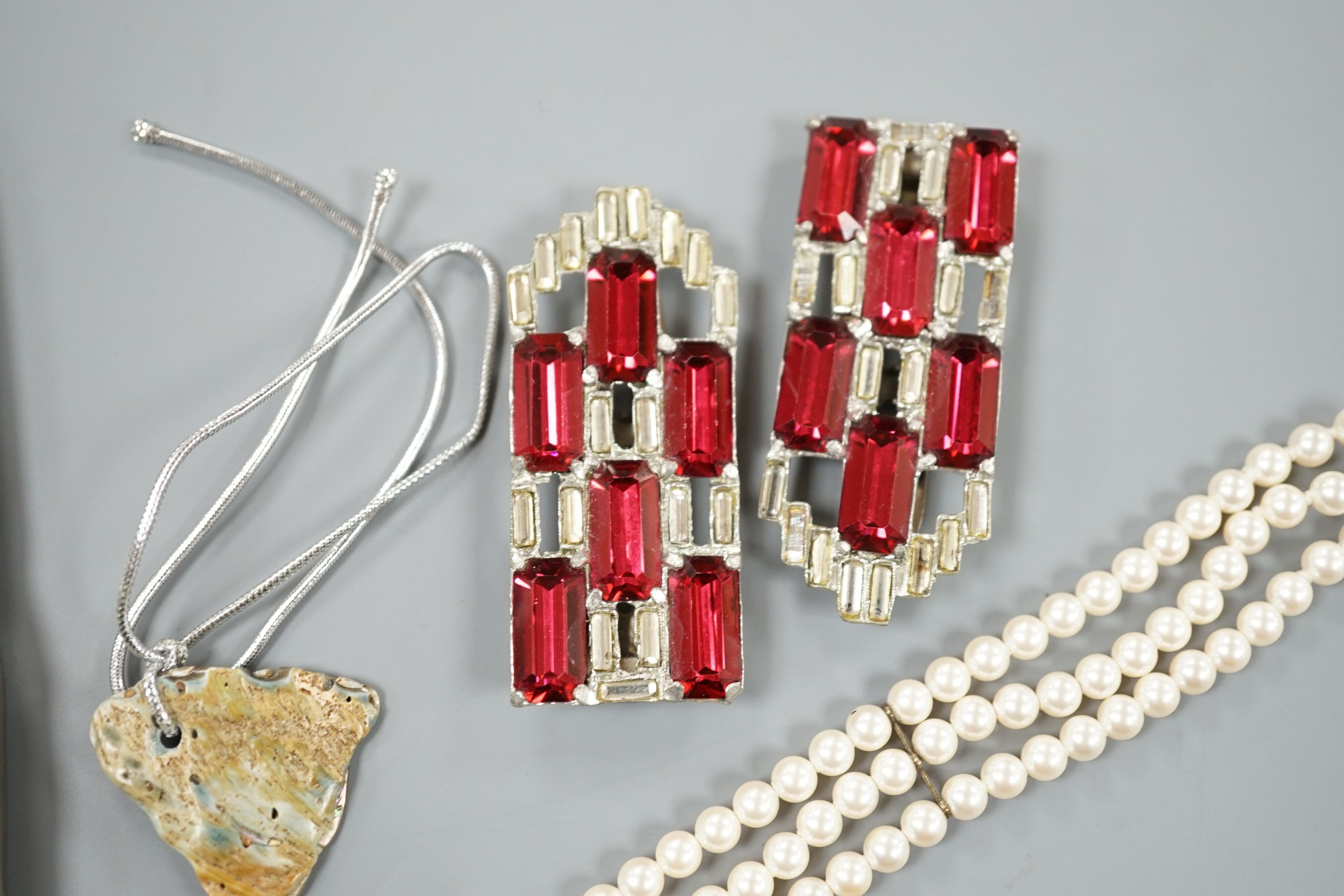 A Cartier gold plated end red enamel ball point pen and minor costume jewellery.